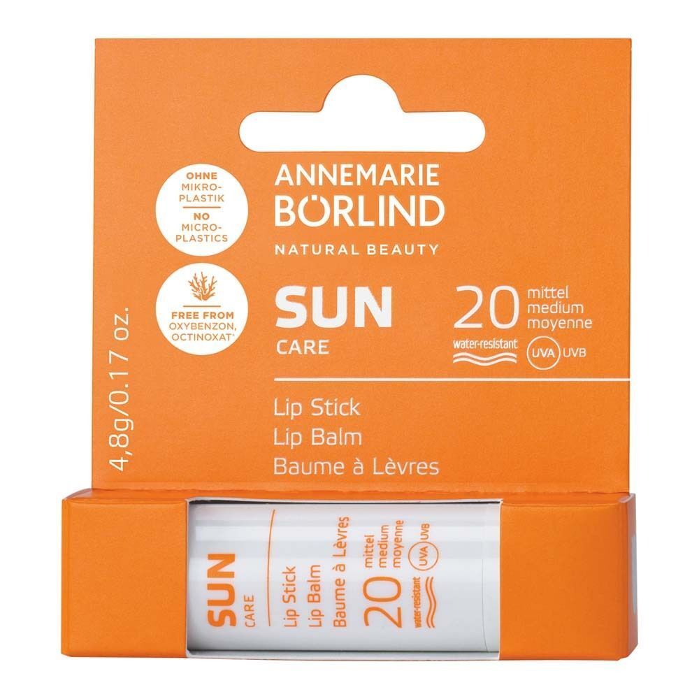 ANNEMARIE BÖRLIND SUN CARE Lippenstift LSF 20 in orangefarbener Faltschachtel.