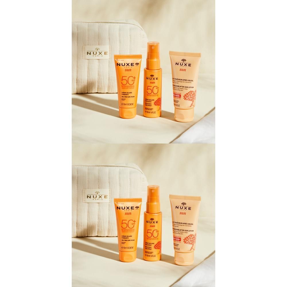 Set mit Kosmetikprodukten. Enthält eine cremefarbene Tasche, Sonnencreme-Tuben und -Sprays. Aufschrift: NUXE SUN.