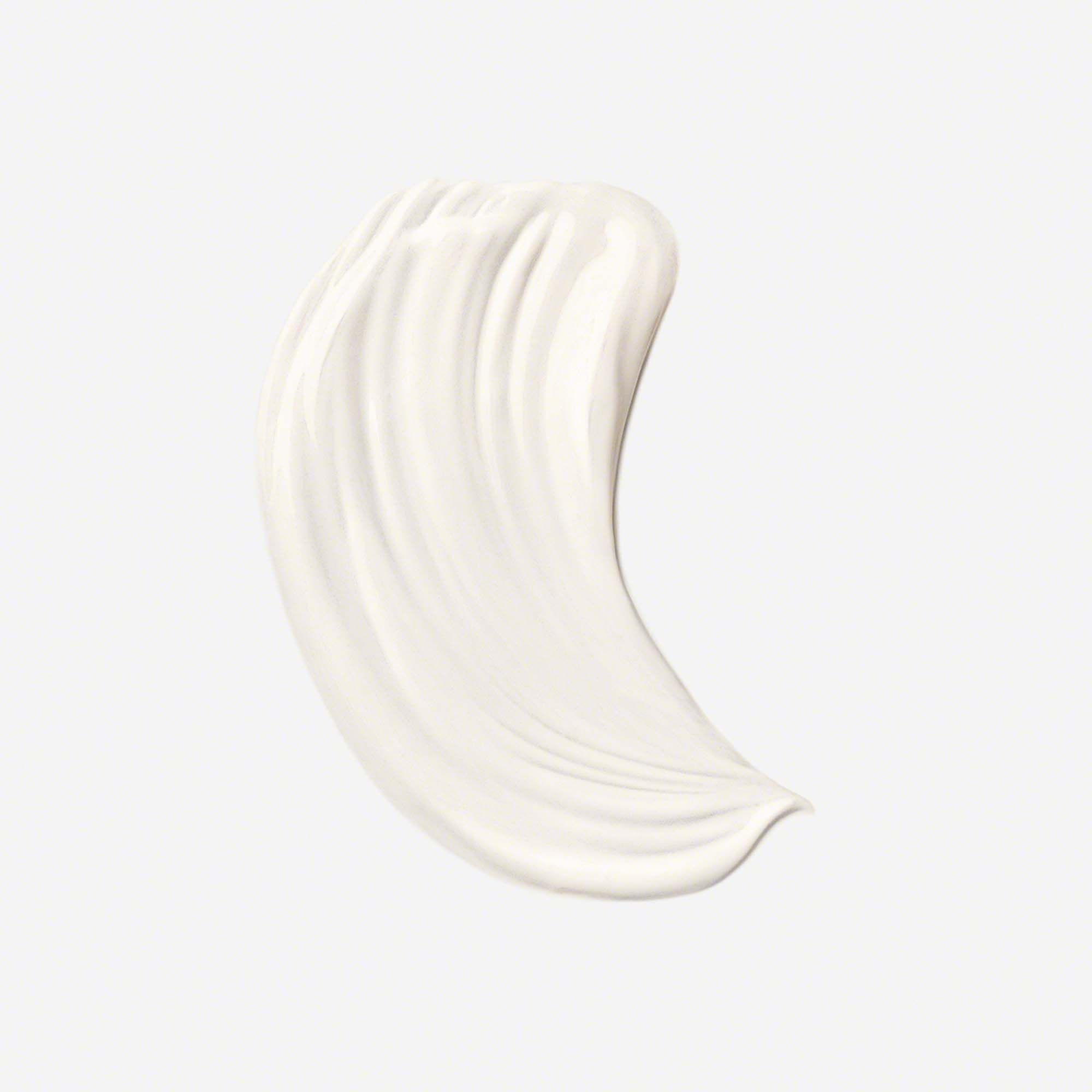 Eine weiße Creme-Textur in geschwungener Form.