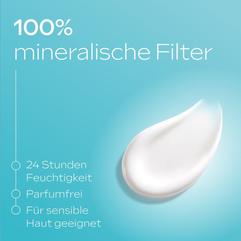 Weisse Creme auf blauem Hintergrund. Text: 100% mineralische Filter, 24 Stunden Feuchtigkeit, parfümfrei, für sensible Haut.