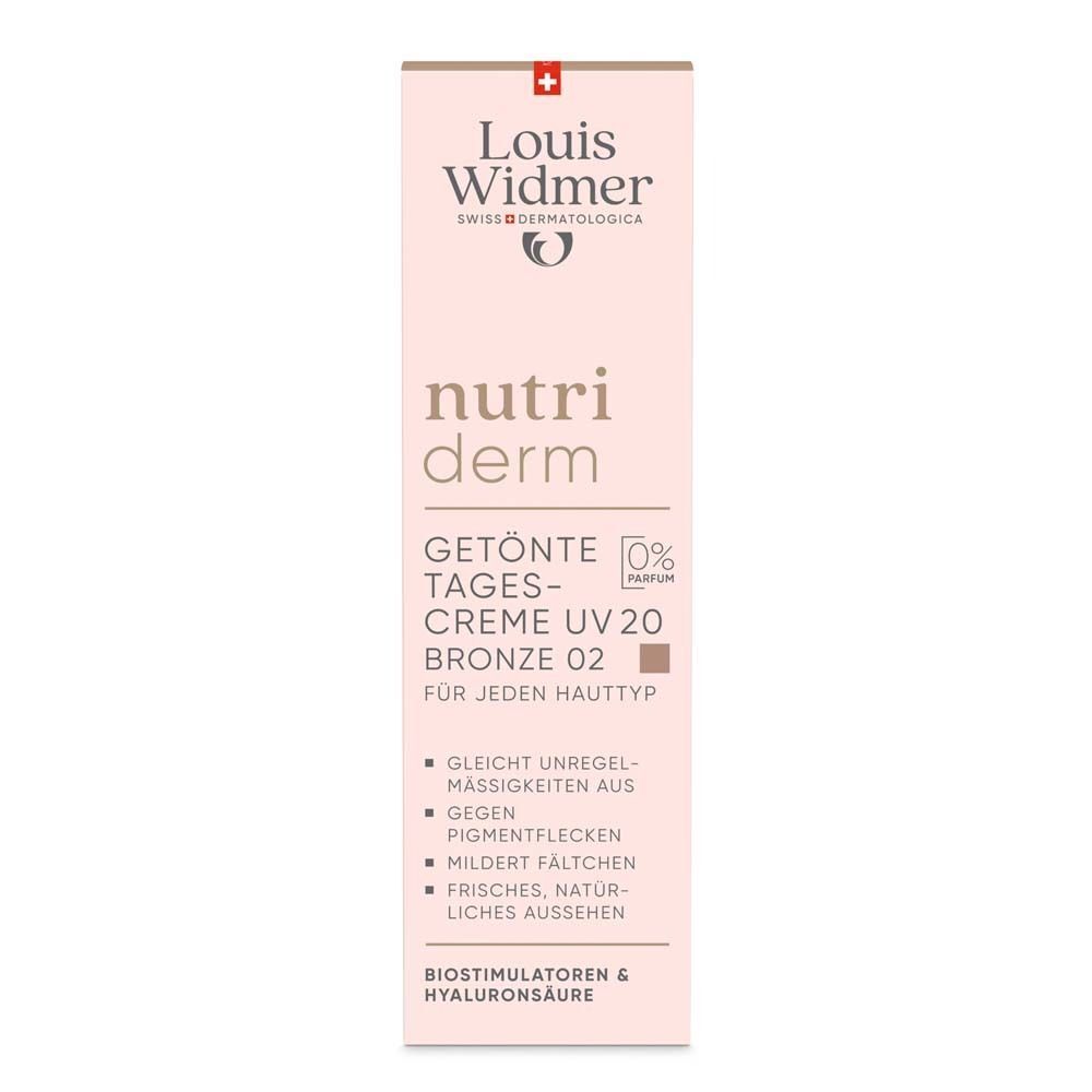 Aufrechte Verpackung für getönte Tagescreme. Rosa Hintergrund, Produktinformationen, Logo und braune Farbmarkierung.