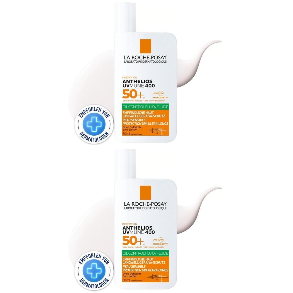 Zwei weiße Flaschen mit orangefarbenen und grünen Etiketten. Aufschrift: Anthelios UVMune 400 50+. Empfohlen von Dermatologen.