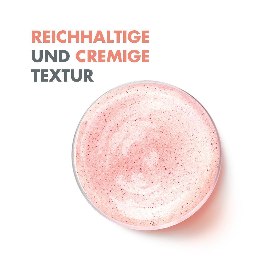 Draufsicht auf eine Schale mit rosa Peeling-Gel. Cremige Textur mit kleinen Partikeln. Text: Reichhaltige und cremige Textur.