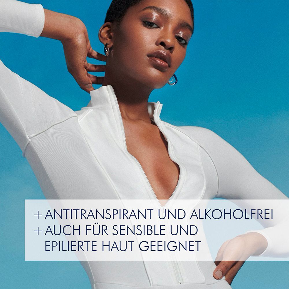 Nahaufnahme einer Frau in weißem Outfit. Text: + Anti-Transpirant und alkoholfrei + Auch für sensible und epilierte Haut geeignet.