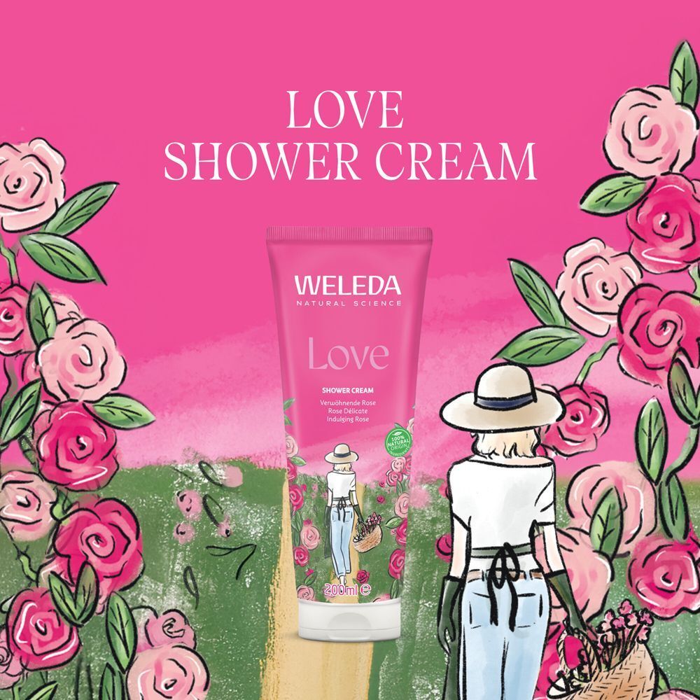 Weleda Love Shower Cream Tube vor floralem Hintergrund. Text: Love Shower Cream.