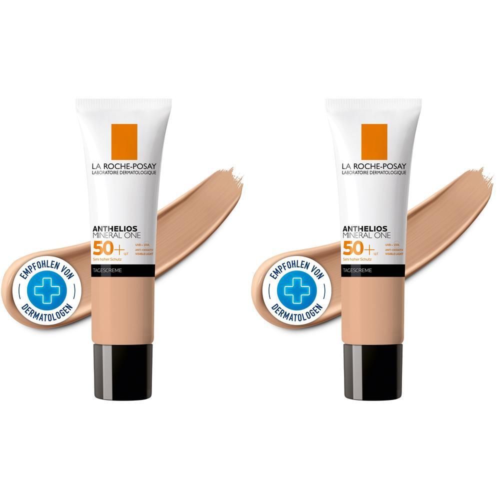 Zwei Tuben La Roche-Posay Anthelios Mineral One LSF 50+ 03 Tan. Aufgetragenes Produkt in Hautton. Mit Empfohlen von Dermatologen-Siegel.