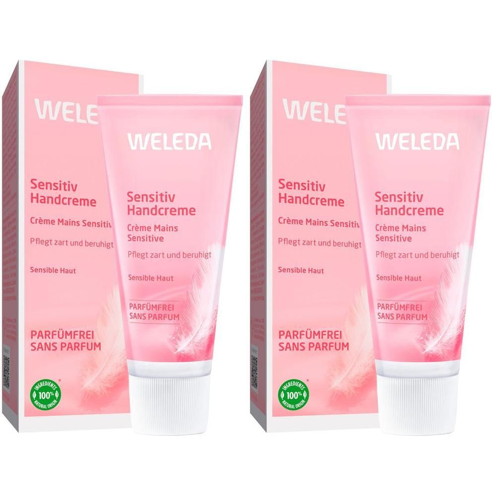 Zwei Tuben und Schachteln Handcreme. Rosa Tuben mit weißem Verschluss und rosa Schachteln. Text: WELEDA, Sensitiv Handcreme, parfümfrei.