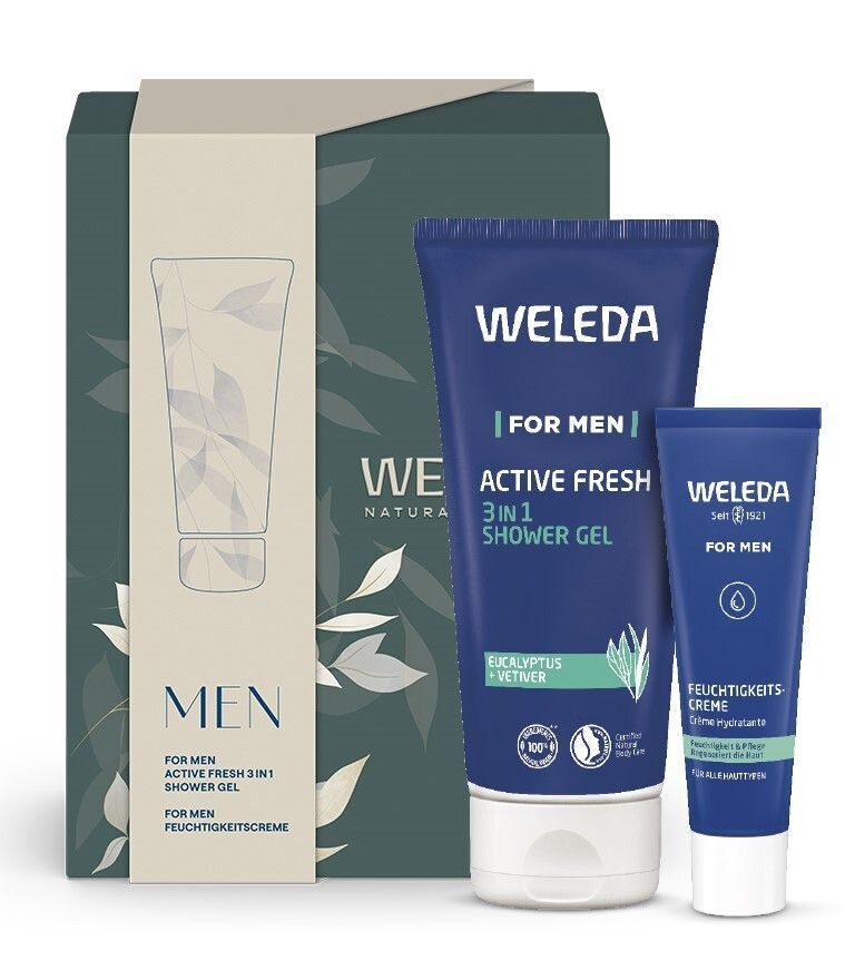 Geschenkset mit 3in1 Duschgel und Feuchtigkeitscreme. Blaue Tuben mit WELEDA-Logo. Verpackung: Grün und beige.