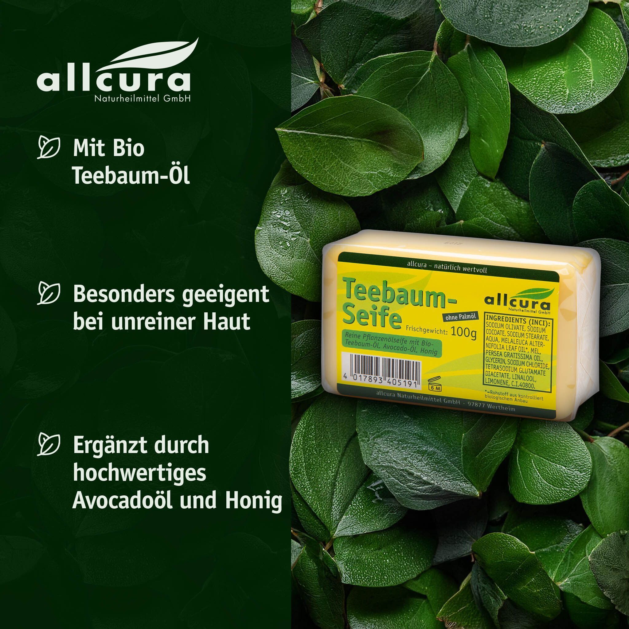 Seifenstück auf Blättern. Gelbes Seifenstück mit grünem Etikett. Aufschrift: Teebaum-Seife, 100g, Inhaltsstoffe. Text: Mit Bio Teebaum-Öl.
