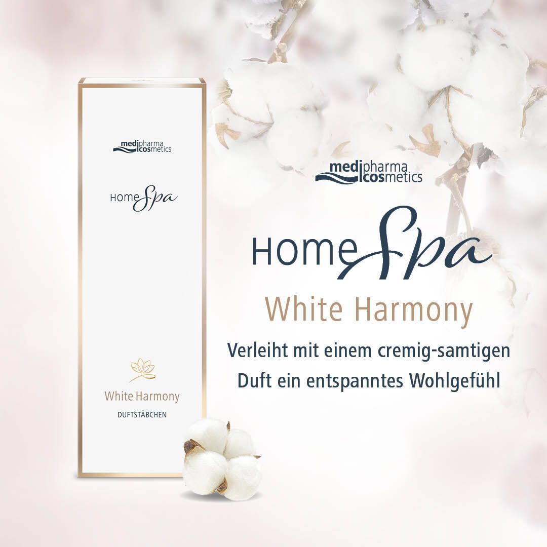 Produktverpackung mit Logo und Schriftzug Home Spa White Harmony. Hintergrund: Baumwollblüten und pastellfarbener Hintergrund.