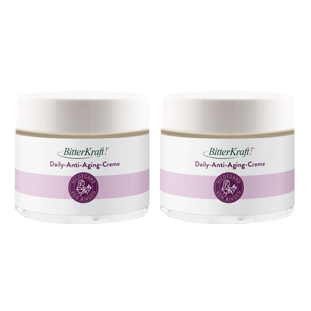 Zwei Tiegel BitterKraft! Daily-Anti-Aging-Creme mit lila Band und Siegel.