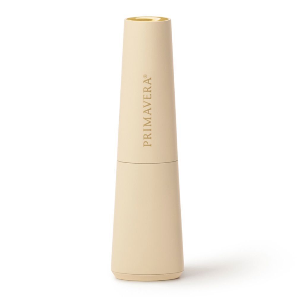 Beiger Aroma Diffusor. Aufschrift: PRIMAVERA. Zylindrische Form, goldfarbener Deckel.