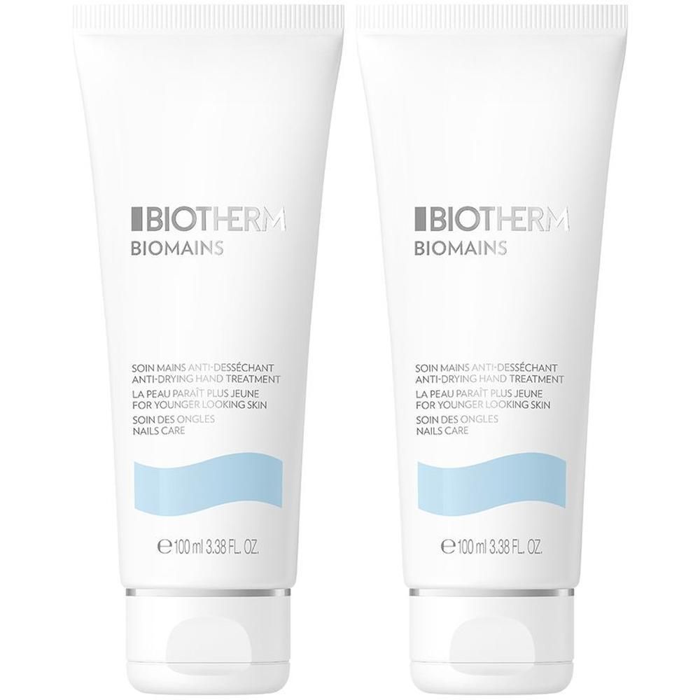 Zwei weiße Tuben BIOTHERM Biomains Handcreme. Aufschrift: Anti-Desséchant Hand Treatment, für jünger aussehende Haut, Nagelpflege.