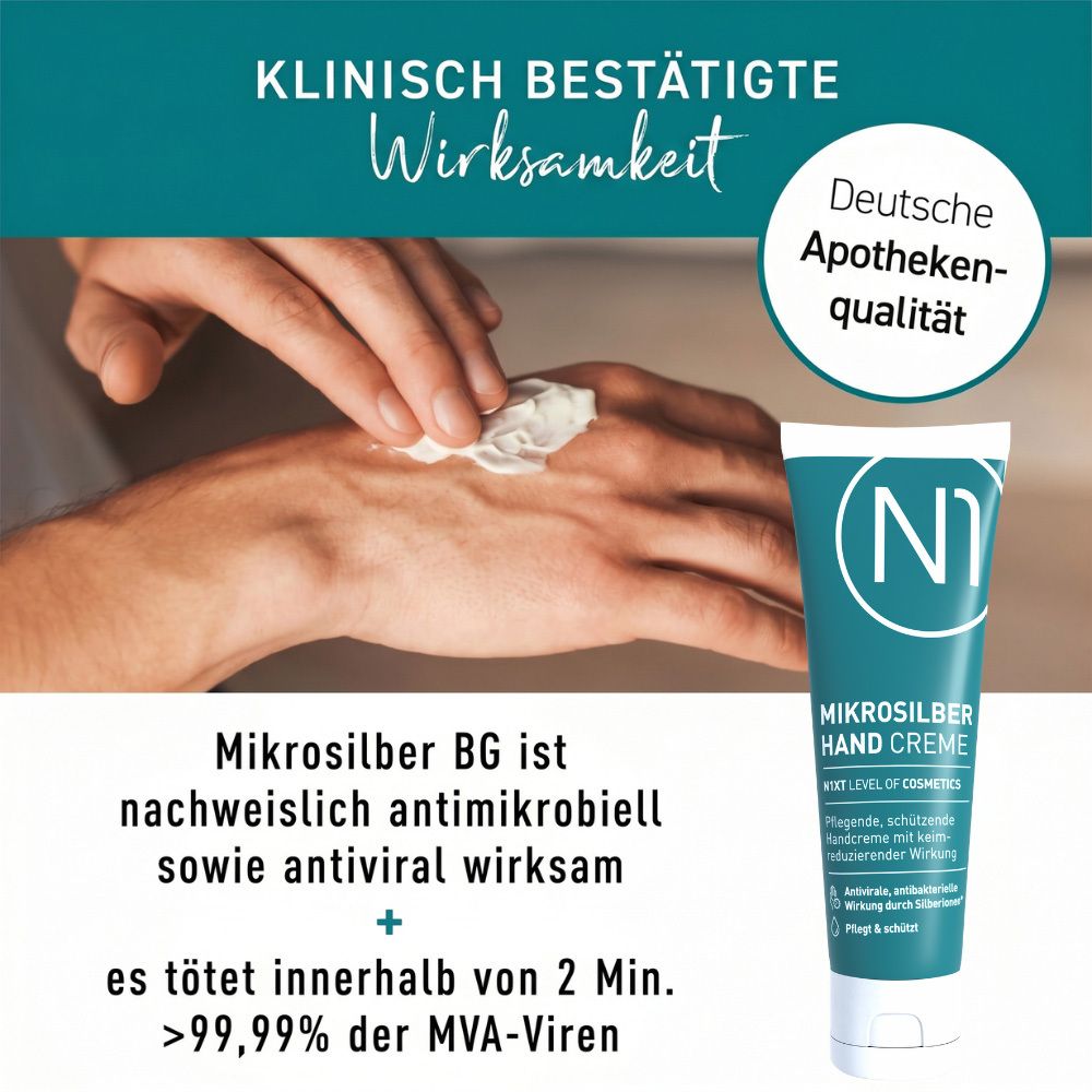 Eine Hand wird mit einem Tuch abgetupft, daneben eine Tube N1 Mikrosilber Handcreme.