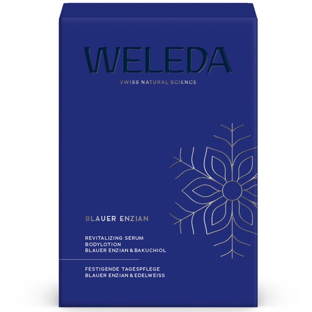 Blaue Geschenkverpackung mit WELEDA-Logo und Text. Enthält: Blauer Enzian. Mit floralem Design.