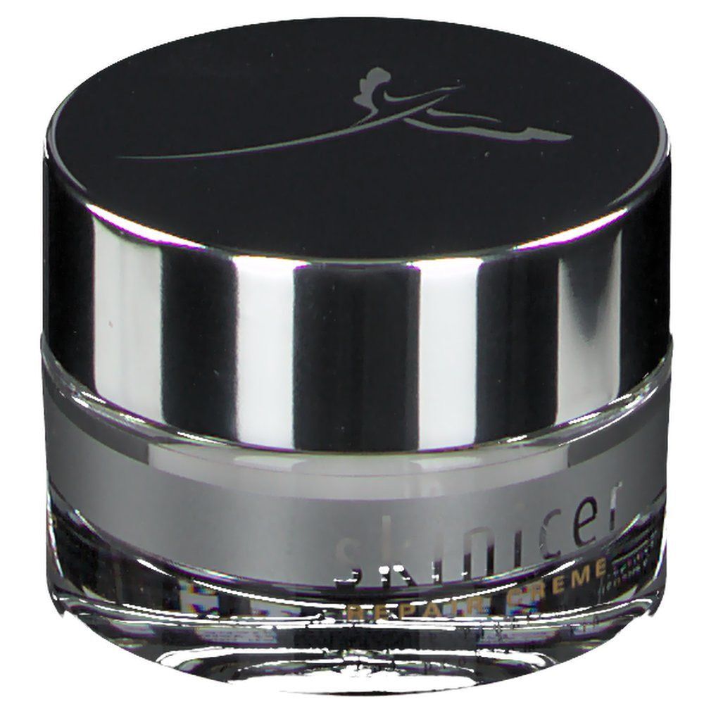 Cremetiegel mit silberfarbenem Rand und Deckel. Auf dem Deckel ein Logo. Schriftzug skinicer® Repair Creme.