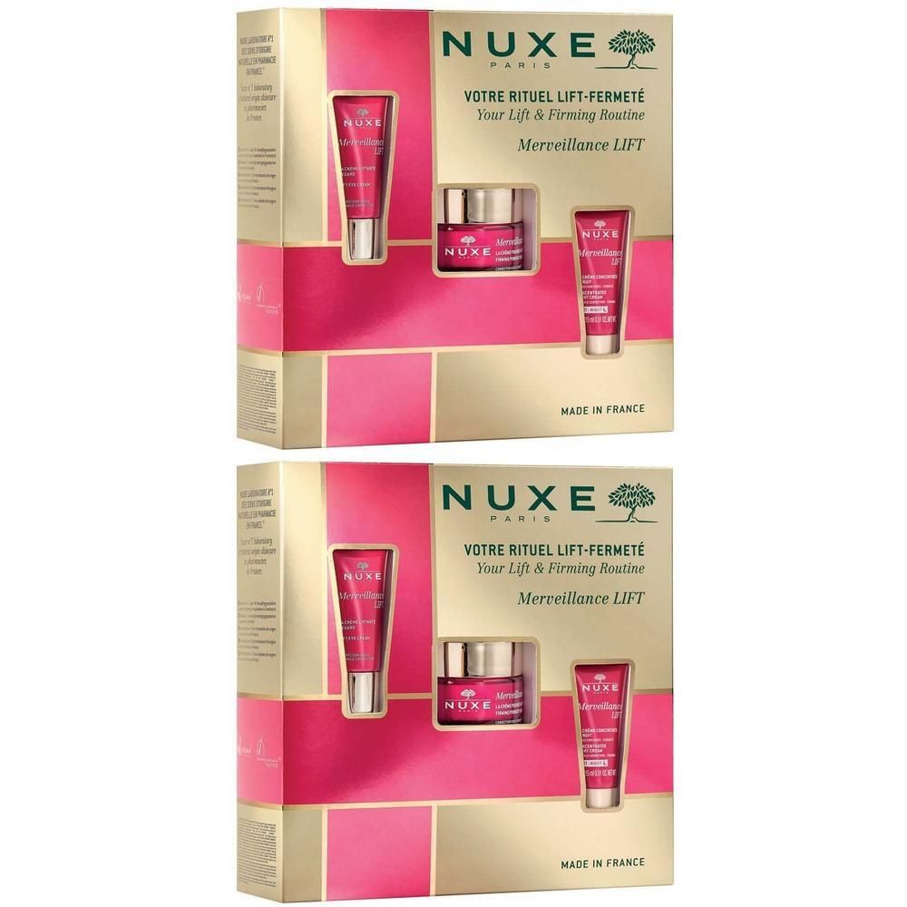 Zwei Geschenksets mit Kosmetikprodukten. Goldfarbene Verpackung mit rosa Akzenten. Enthält Tuben und Tiegel.