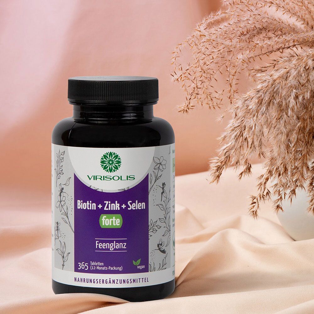 Flasche VIRISOLIS Biotin + Zink + Selen forte. Schwarze Flasche mit weißem Etikett. Aufschrift: Biotin + Zink + Selen forte. Auf rosa Hintergrund.