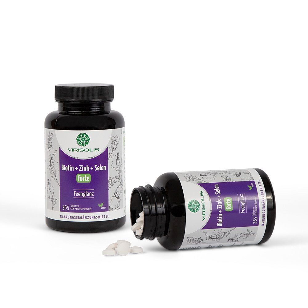 Zwei Flaschen VIRISOLIS Biotin + Zink + Selen forte. Eine Flasche liegt, Tabletten daneben. Aufschrift: Biotin + Zink + Selen forte.