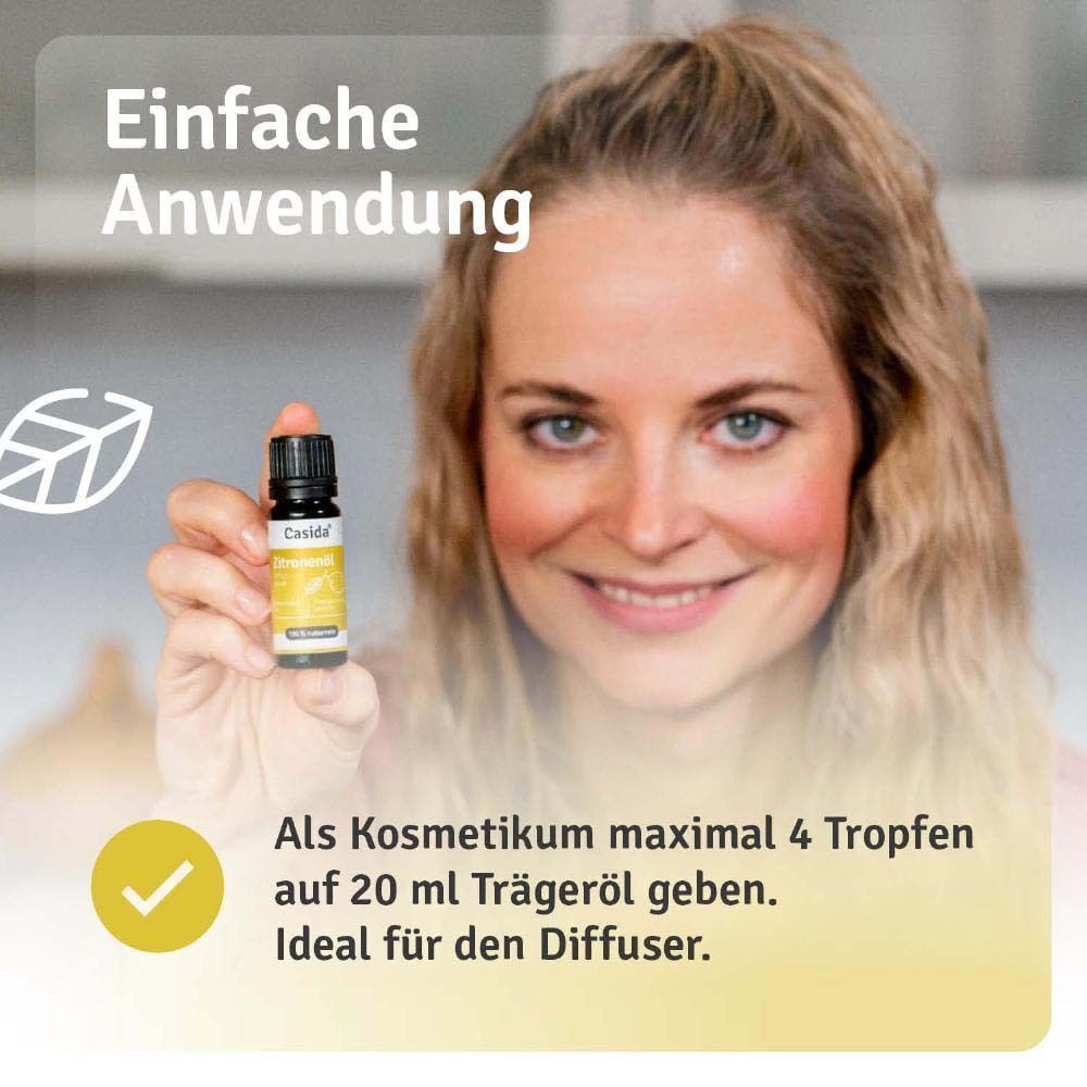 Frau hält Casida Zitronenöl Flasche. Anwendungshinweis: maximal 4 Tropfen auf 20 ml Trägeröl. Ideal für den Diffuser.