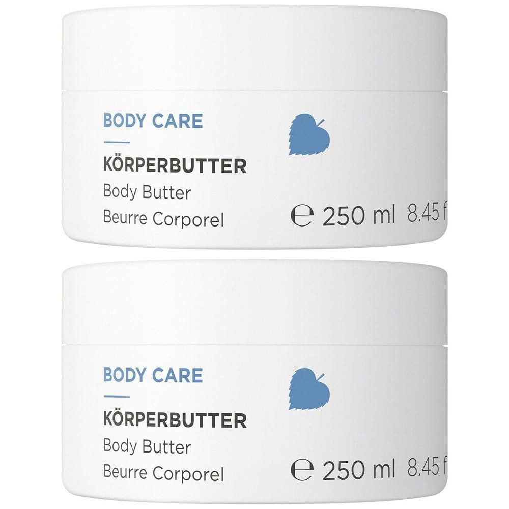 Zwei weiße Tiegel mit ANNEMARIE BÖRLIND BODY CARE Körperbutter, 250 ml.