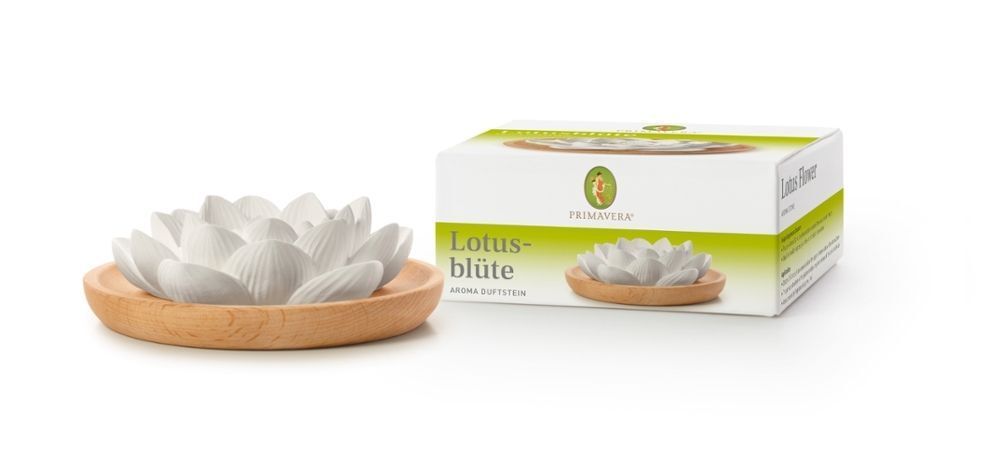 Aroma-Duftstein in Lotusblütenform auf Holzschale neben Produktverpackung. Verpackung mit Logo und Produktnamen.
