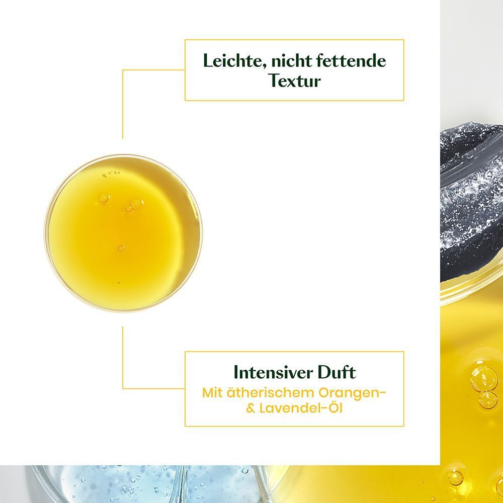 Nahaufnahme von gelber Flüssigkeit. Text: Leichte, nicht fettende Textur. Intensiver Duft mit ätherischem Orangen- & Lavendel-Öl.