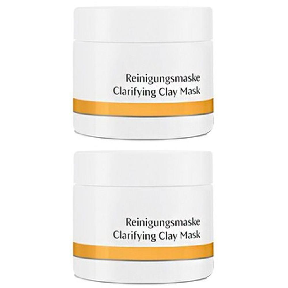 Zwei weiße Tiegel mit Reinigungsmaske und Clarifying Clay Mask Aufschrift.