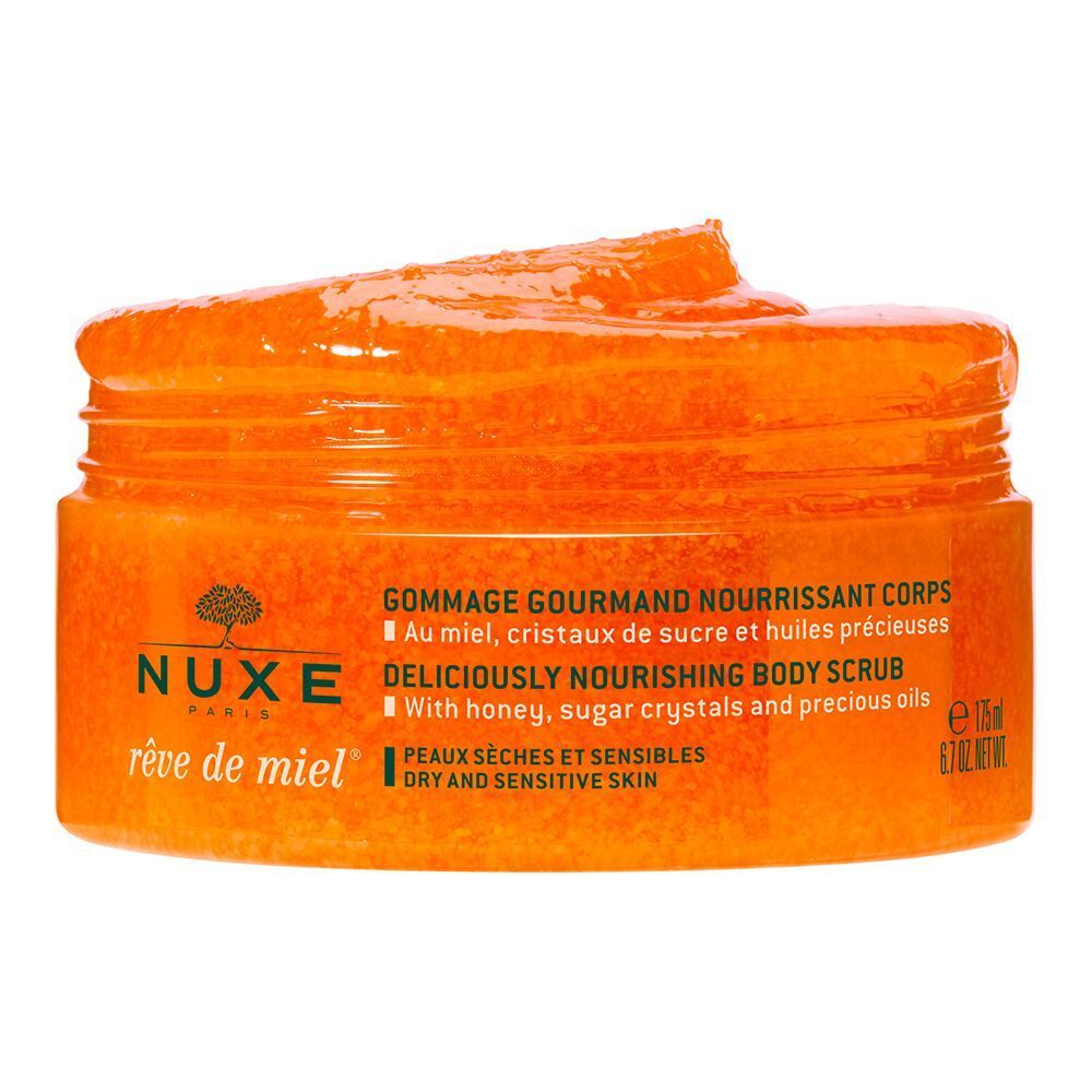 Offener Tiegel Körperpeeling. Orangefarbenes Produkt. Text: NUXE, Reve de Miel, Gommage Gourmand Nourrissant Corps.