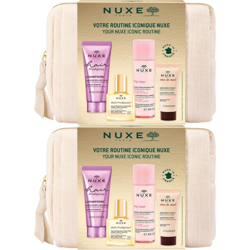 Zwei Kosmetiktaschen mit NUXE-Produkten. Jede Tasche enthält Shampoo, Trockenöl, Gesichtscreme und ein weiteres Produkt. Made in France.