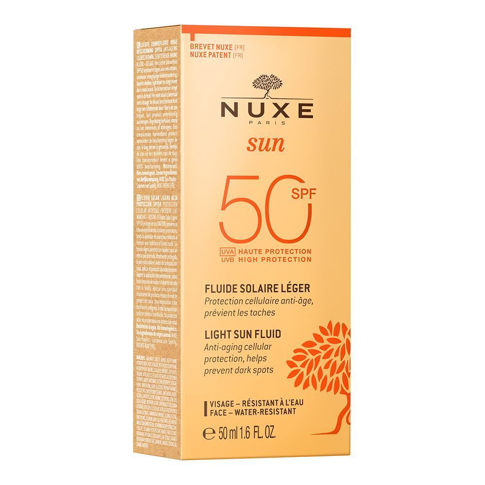 Gelbe Verpackung mit Sonnenfluid. Aufschrift: NUXE Sun, SPF 50, Fluide Solaire Léger, Anti-Aging-Schutz, hilft, dunkle Flecken zu verhindern.