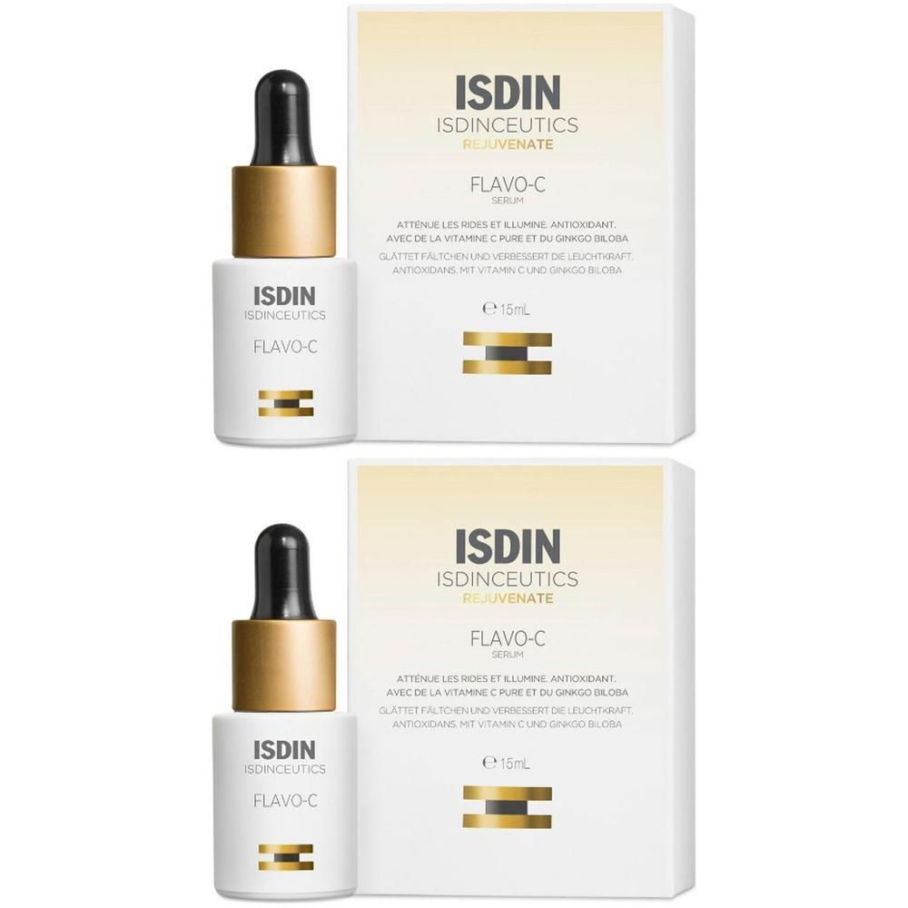 Zwei Flaschen mit Pipette und Verpackung. Aufschrift ISDIN Isdinceutics Flavo-C. Weiße Flaschen, goldfarbene Kappe.
