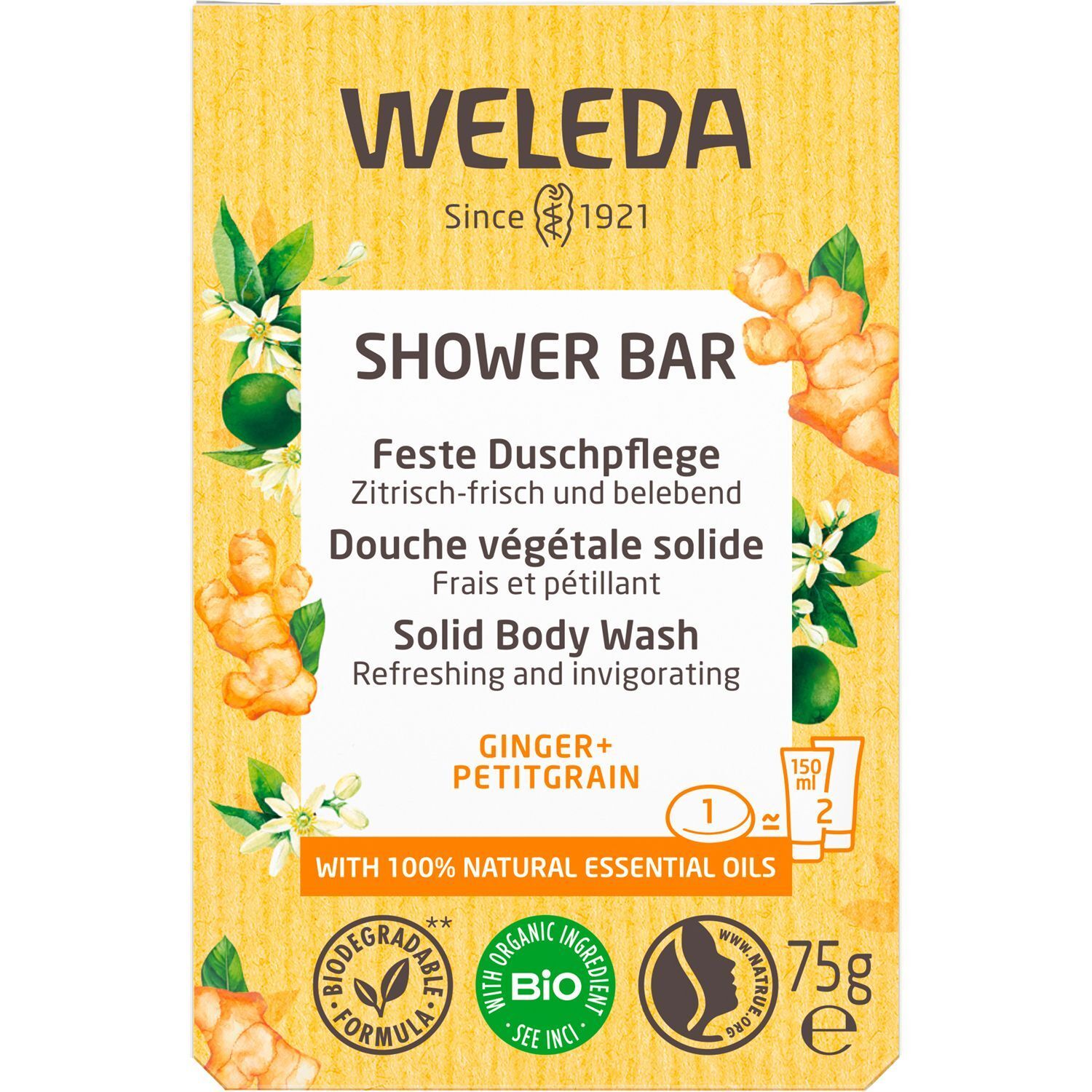 Gelbe Schachtel mit Text: "WELEDA SHOWER BAR". Produktname: Ginger+Petitgrain. Mit Bio-Zertifizierung. 75g. Abbildung von Ingwer und Blättern.