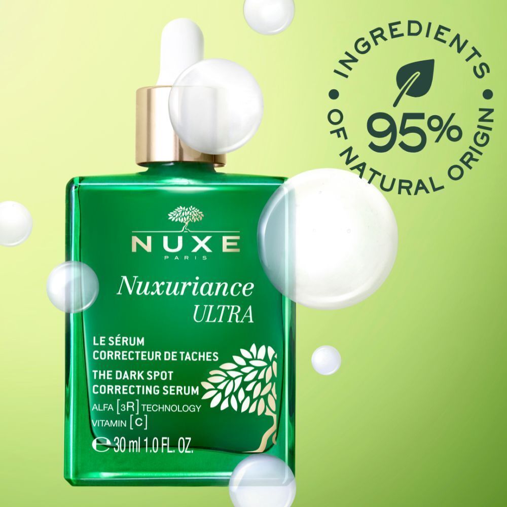 Grüne Serumflasche mit weißer Pipette. Aufschrift: NUXE Nuxuriance Ultra, Le Sérum Correcteur de Taches, 30 ml. 95% natürliche Inhaltsstoffe.