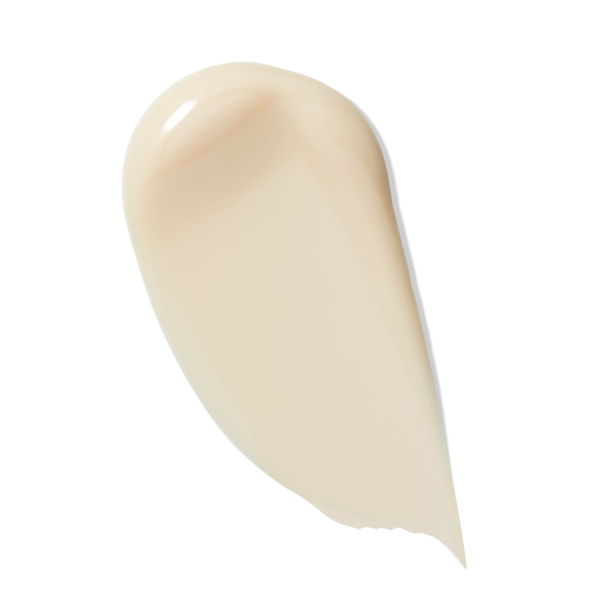 Creme-Ausstrich in hellem Farbton. Glatte Textur, längliche Form, vor weißem Hintergrund.