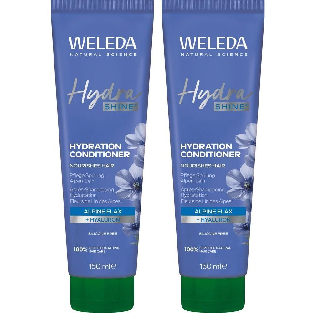 Zwei Tuben Weleda Hydra Shine Pflege Spülung. Blaue Tuben mit grünem Verschluss. Text: Hydra Shine, Alpine Flax + Hyaluron, 150 ml.
