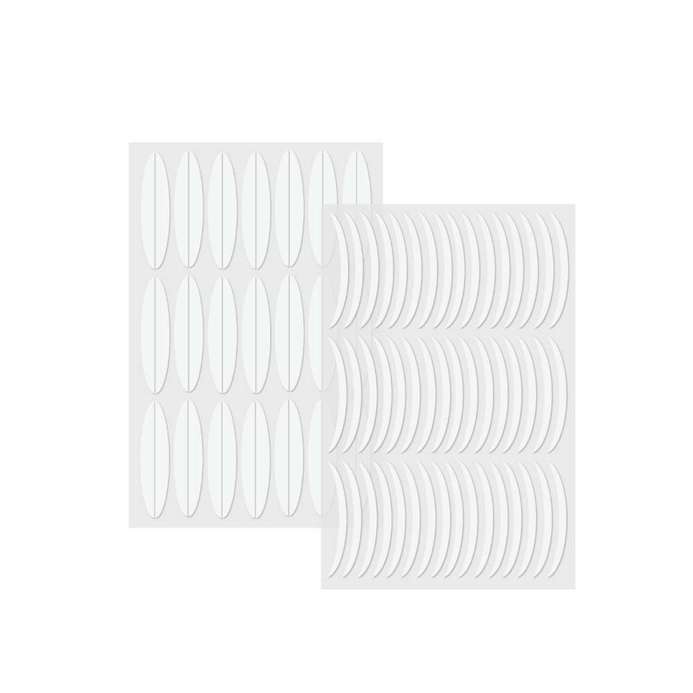 Zwei Blätter mit weißen, ovalen Eyelid Lifting Tapes. Die Tapes sind auf transparentem Trägermaterial angeordnet.
