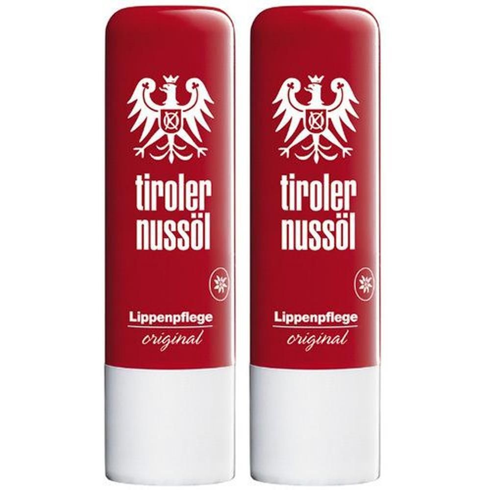 Zwei Lippenpflegestifte mit roter Hülle und weißem Boden. Aufdruck: Tiroler Nussöl, Logo, Lippenpflege original.