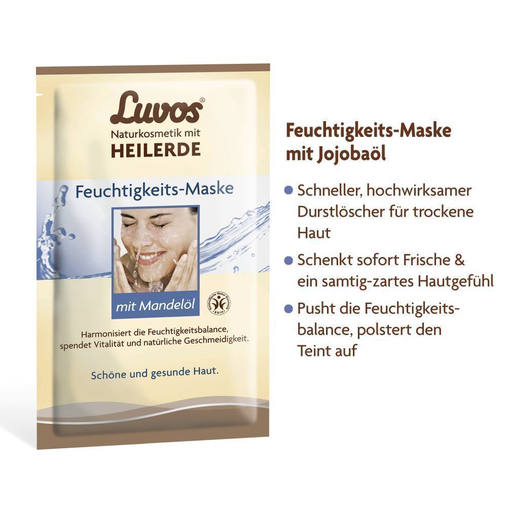 Feuchtigkeitsmaske mit Jojobaöl. Aufschrift: Luvos Naturkosmetik mit Heilerde. Feuchtigkeits-Maske mit Mandelöl. Bild einer Frau. Text über Vorteile.