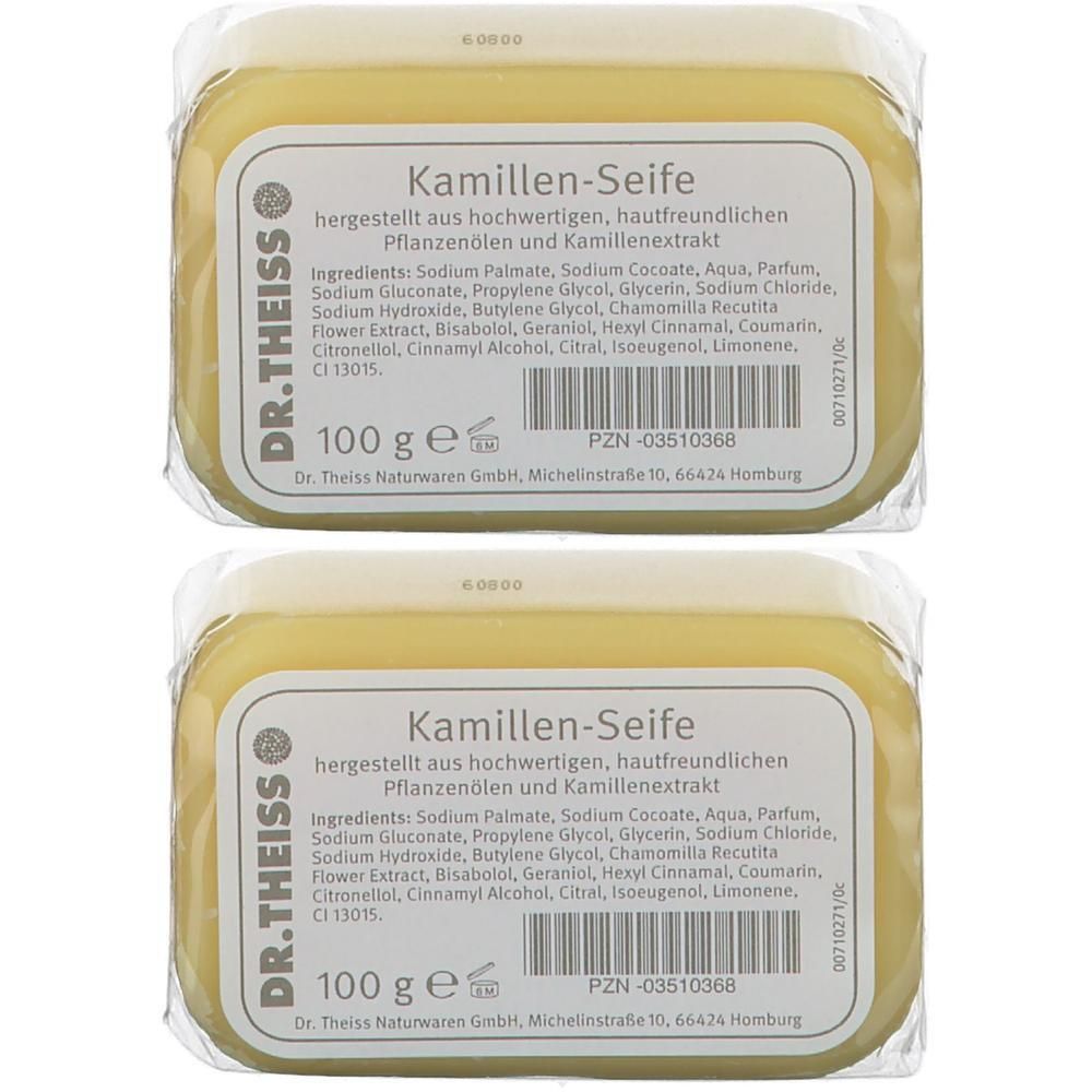 Zwei Seifenstücke mit Etikett. Aufschrift: Kamillen-Seife, DR. THEISS. Gelbe Seife in transparenter Verpackung. 100 g.