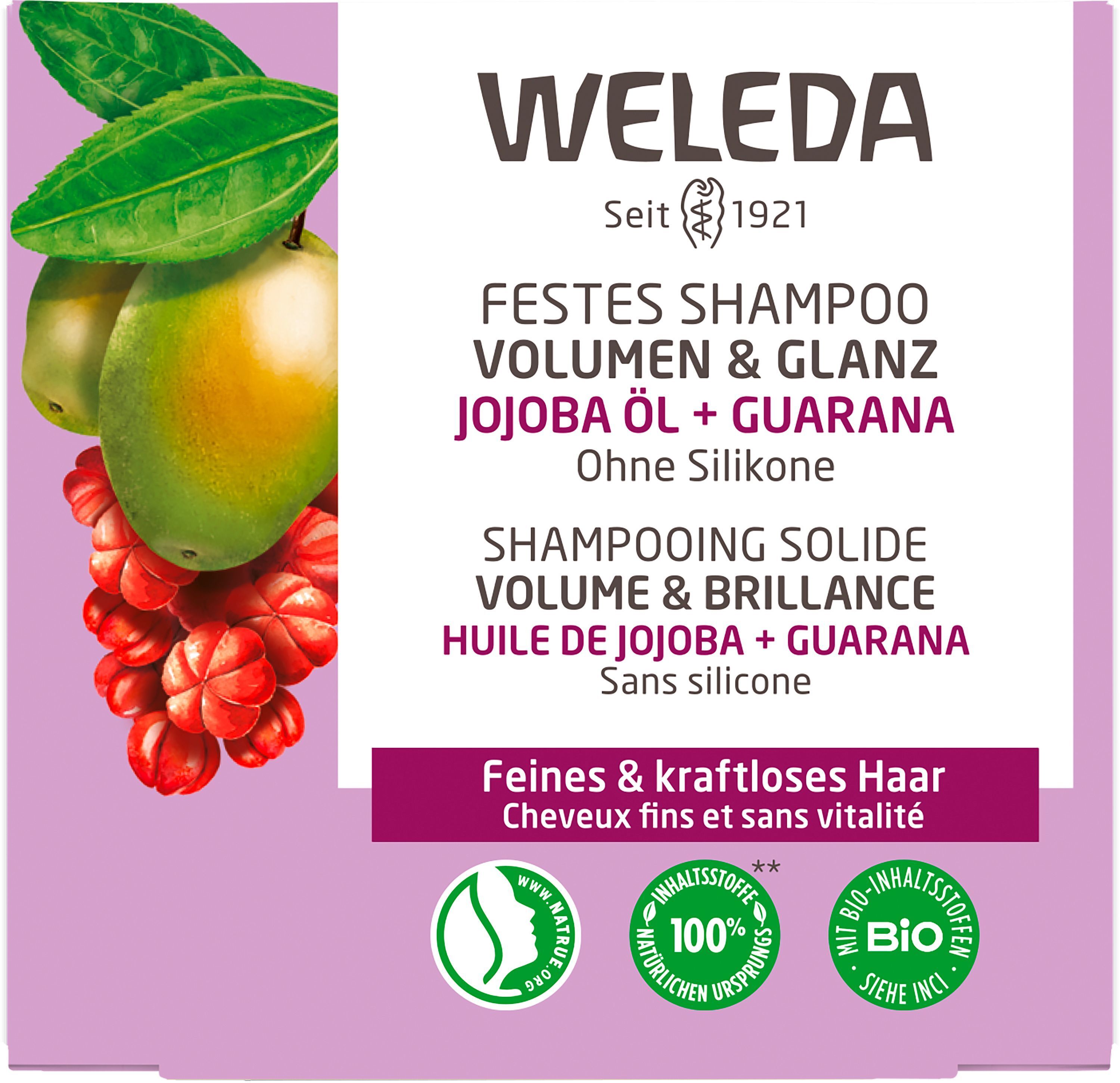 Nahaufnahme der Verpackung des festen Shampoos WELEDA. Produktinformationen, Logo und Zertifizierungen.