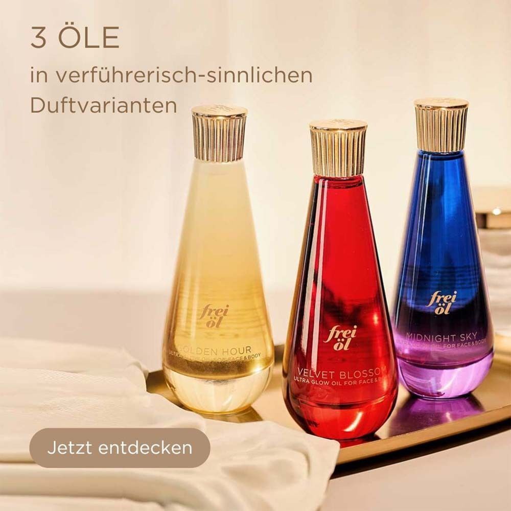 Drei Flaschen mit goldenen Verschlüssen. Auf jeder Flasche steht "frei öl".
