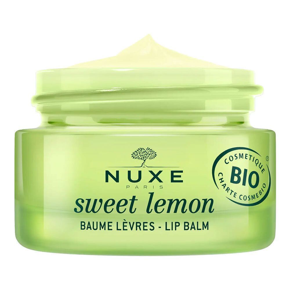 Offener grüner Tiegel NUXE Sweet Lemon Lippenbalsam. Aufschrift: Sweet Lemon, Baume Lèvres - Lip Balm. Bio-Zertifizierung.