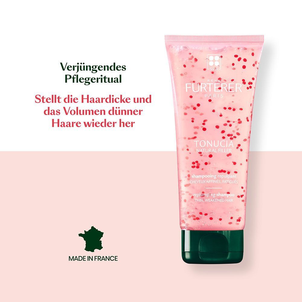 Eine Tube Shampoo. Rosa Flüssigkeit mit roten Partikeln. Grüner Verschluss. Text: FURTERER PARIS, TONUCIA NATURAL FILLER. Made in France.