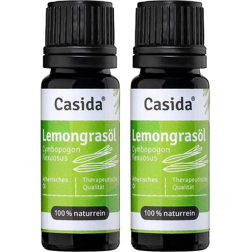 Zwei Flaschen Casida® Zitronengrasöl. Schwarze Kappen, grüne Etiketten mit Produktnamen und Inhaltsangaben. 100% naturrein.