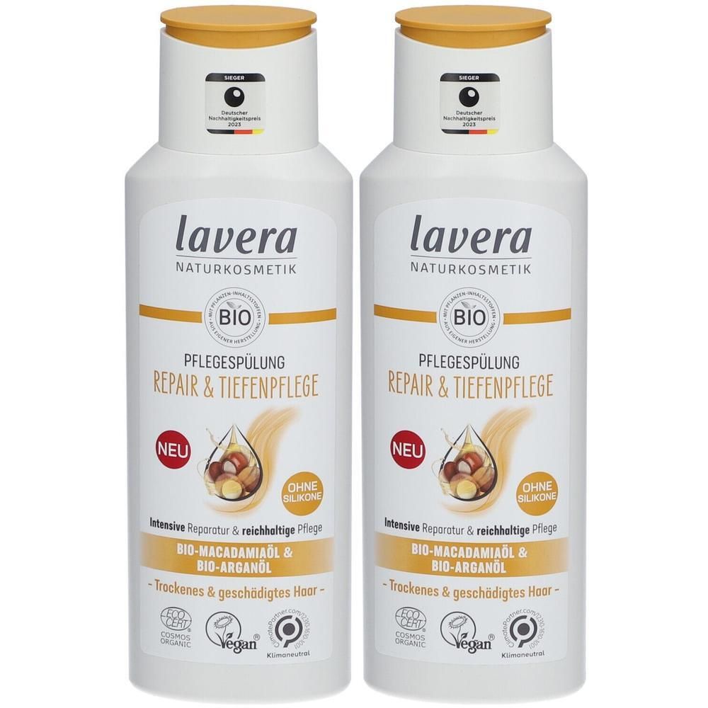 Zwei weiße Flaschen mit gelbem Deckel. Aufschrift: lavera NATURKOSMETIK, BIO, Pflegespülung Repair & Tiefenpflege. Mit veganem Siegel und Qualitätszeichen.