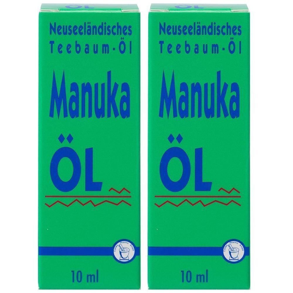 Zwei grüne Schachteln mit blauem Text: Manuka Öl, Neuseeländisches Teebaum-Öl. Unten steht 10 ml. Logo mit Mörser und Stößel.