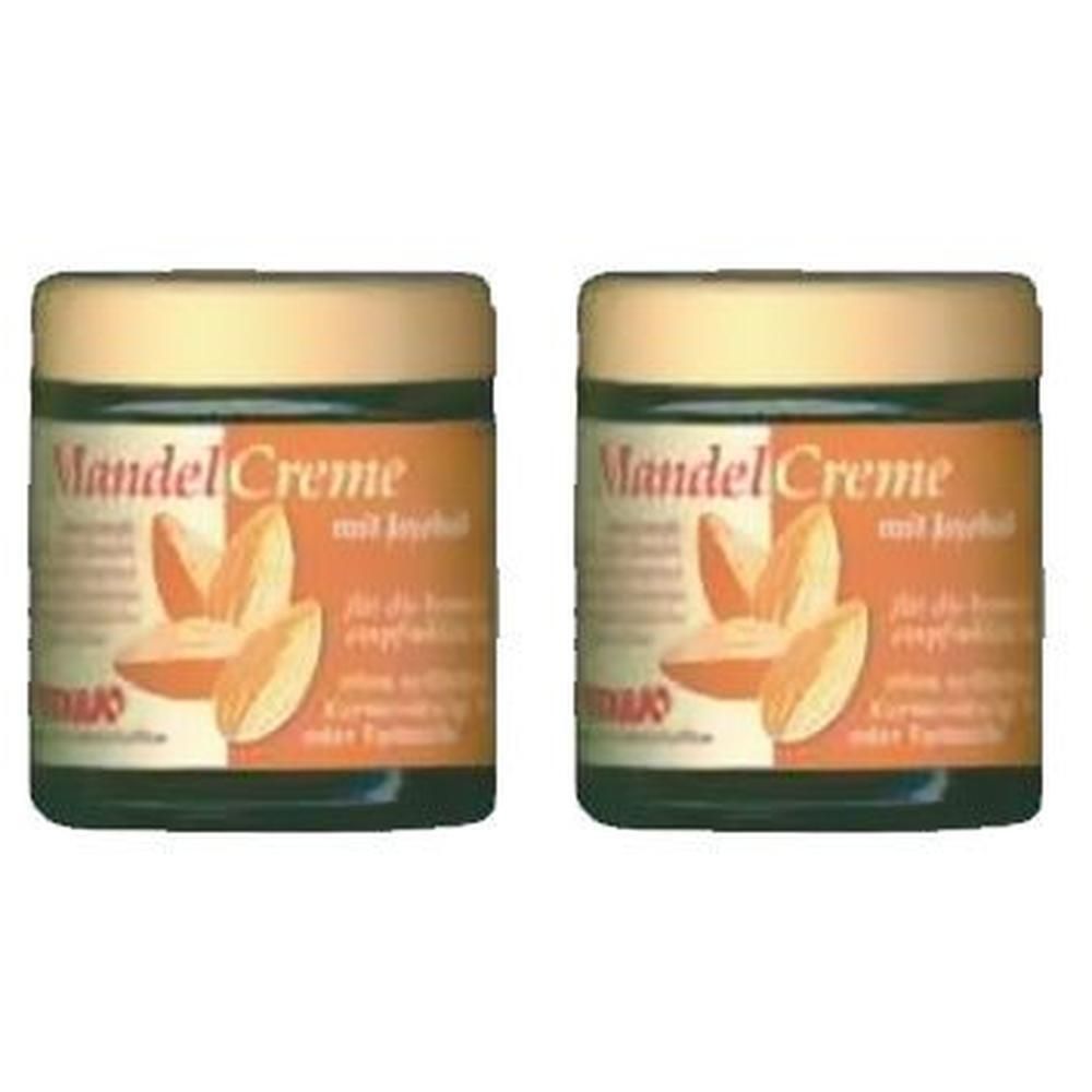Zwei Tiegel Mandelcreme mit Jojoba-Öl. Aufschrift: Mandel Creme mit Inhalt. Abbildung von Mandeln. Braune und grüne Verpackung.
