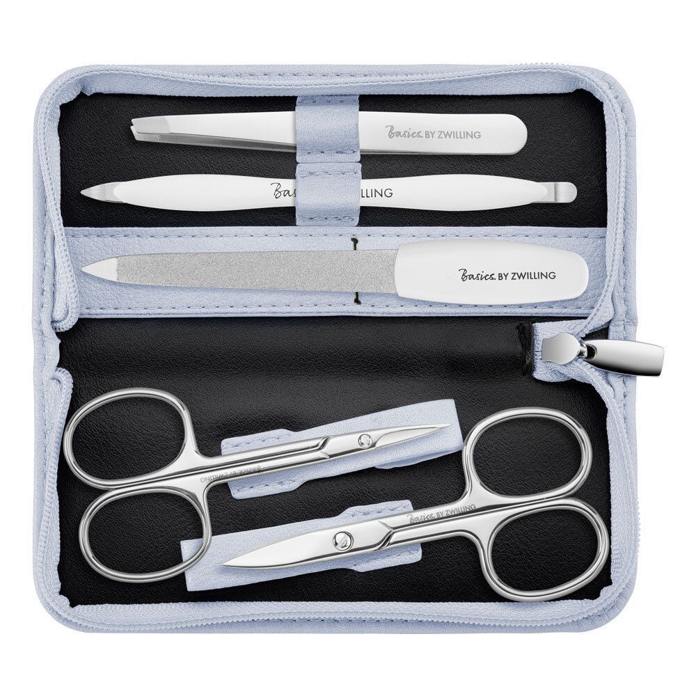 Nagelpflege-Set, geöffnet. Enthält Schere, Pinzette, Nagelfeile und Werkzeuge. Blaues Etui. Basics by Zwilling.