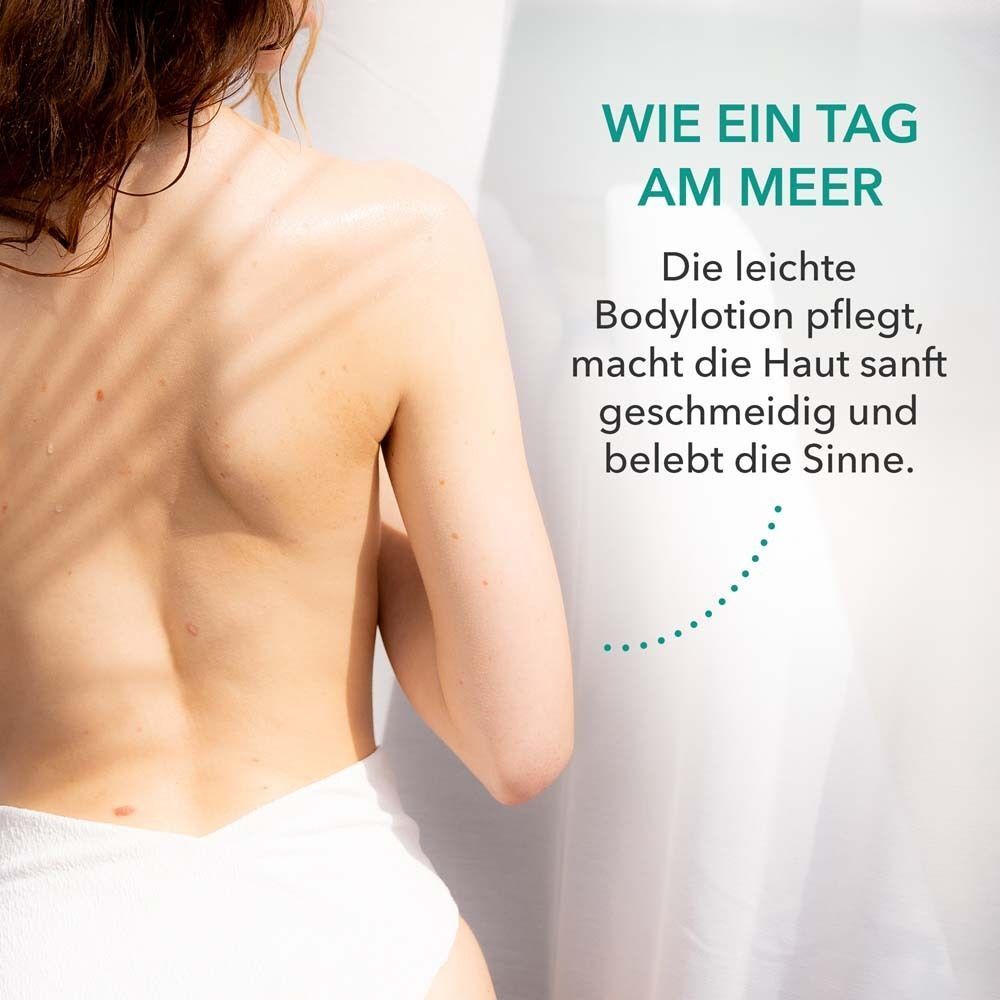 Rücken einer Frau. Text: Die leichte Bodylotion pflegt, macht die Haut sanft geschmeidig und belebt die Sinne.